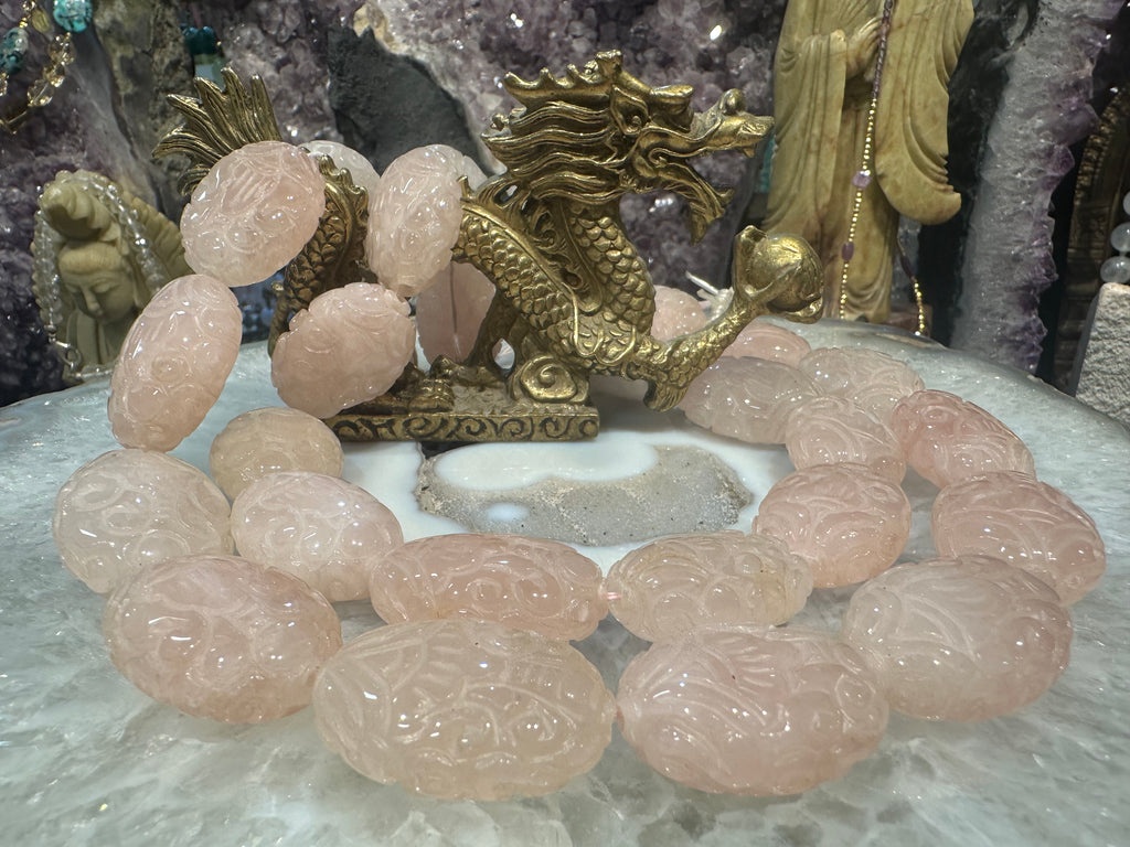Rose quartz carved 29x22mm oval gemstone