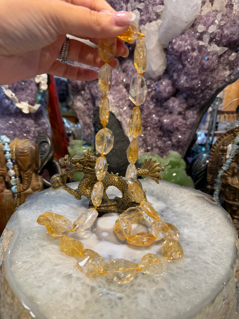 Stunning citrine faceted gem cut long knotted gemstone